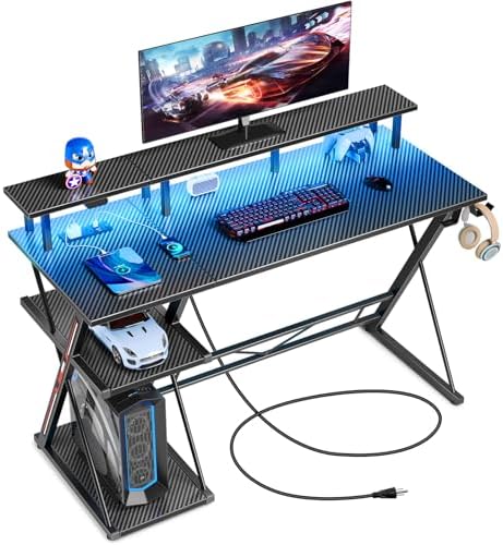 SEVEN WARRIOR Gaming Desk with LED Lights & Power Outlets, 39" Computer Desk with Monitor Stand & Storage Shelf, Gaming Table with Earphone Hook, Office Desk with Footrest, Carbon Fiber Black